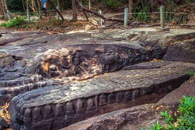 khmer riverbed carving at the river of a thousand lingas / sahasralingas (linga 1,000) of kbal spean. phnom kulen national park (phnom koulen, mountain of lychees), siem reap, cambodia.