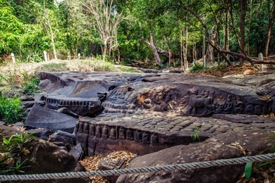 khmer riverbed carving at the river of a thousand lingas / sahasralingas (linga 1,000) of kbal spean. phnom kulen national park (phnom koulen, mountain of lychees), siem reap, cambodia.