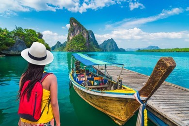 traveler woman looking beautiful destinations place, boat for tourist on phang-nga bay view panyee island scenic nature landscape, travel adventure phuket thailand, tourism asia holidays vacation trip