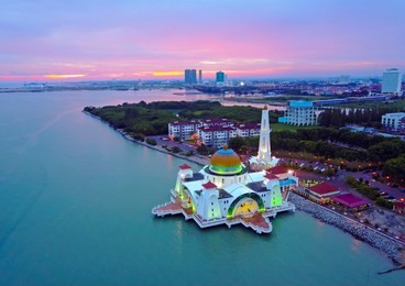 aerial view of majestic malacca straits mosque during magnificent sunset