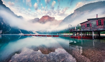 foggy morning view of braies (pragser wildsee) lake. greaty summer sunrise in fanes-sennes-braies national park, dolomiti alps, south tyrol, italy, europe. beauty of nature concept background.