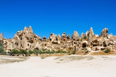 fairy chimneys and old houses in goreme, cappadocia, turkey.