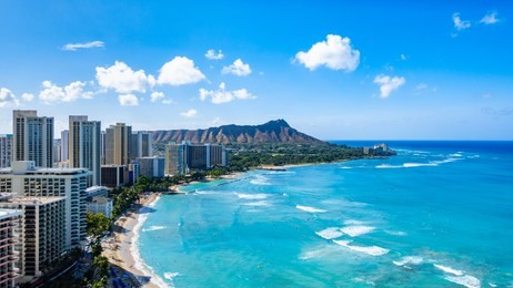 waikiki beach and diamond head crater including the hotels and buildings in waikiki, honolulu, oahu island, hawaii. waikiki beach in the center of honolulu has the largest number of visitors in hawaii