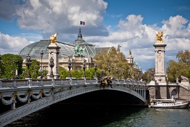 view on the pont alexandre iii in paris, a famous bridge over the seine river in paris. in the rear is the grand palais. france