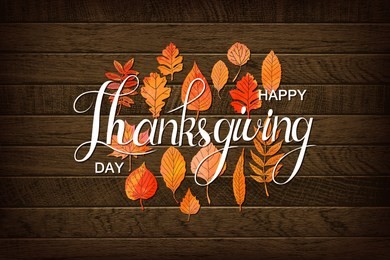 autumn maple leaves and berries on old wooden backgound. thanksgiving greeting card with handwriting happy thanksgiving day . thanksgiving day concept. vector illustration