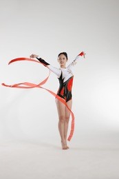 young woman doing rhythmic gymnastics