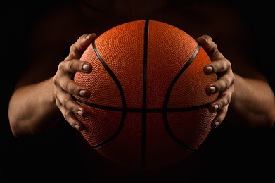 basketball ball in male hands