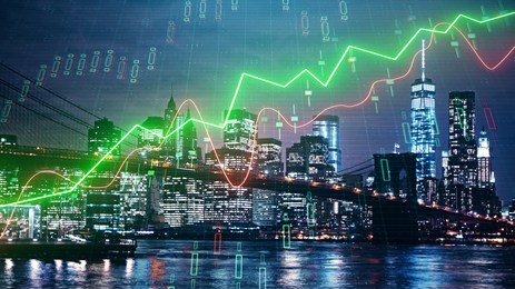 glowing forex chart on night city background. trade and banking concept. double exposure 