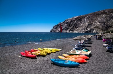black beach of kamari on  santorini, greece.