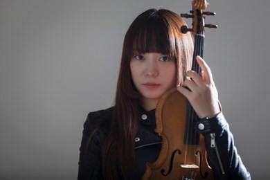 a beautiful woman who plays the violin