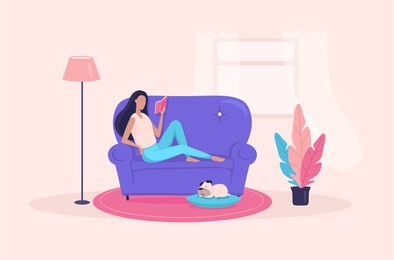 the girl laying on the sofa and reading some  book in her apartment