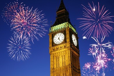 fireworks over big ben seen from parliament square, at night