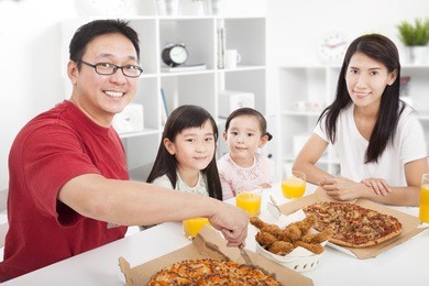 happy asian family enjoy their dinner in the home