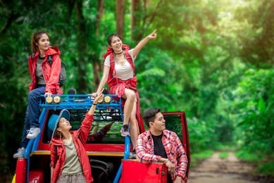 group of asian friends traveling for camping and hiking in the forest by road trip on weekend summer - lifestyle and recreation concept
