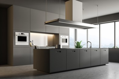 interior of minimalistic kitchen with gray walls, concrete floor, gray countertops with built in appliances, and an island. 3d rendering copy space