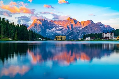 view of lake misurina at cortina d'ampezzo in the morning in italy with the punta sorapis mountain of dolomites in the background