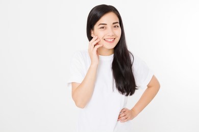 portrait of smiling brunette asian girl with long and shiny straight female hair isolated on white background . beautiful woman korean model with straight hairstyle. skin care. copy space.
