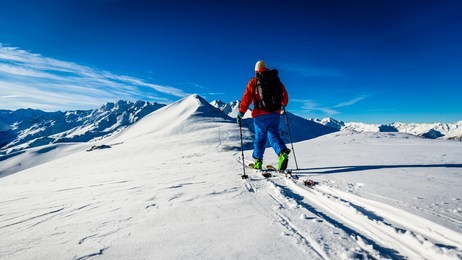 ski with amazing view of swiss famous mountains in beautiful winter snow mt fort. the skituring, backcountry skiing in fresh powder snow.