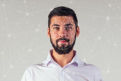 portrait of a young handsome businessman on a black background. biometric verification, face concept