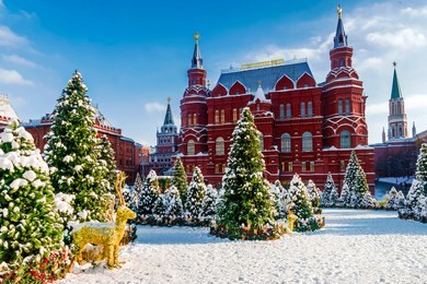 christmas in moscow. manezhnaya square in moscow. the inscription on the building in russian: historical museum