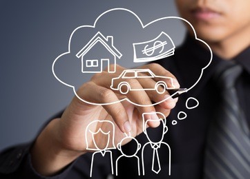 businessman drawing dream house in a whiteboard
