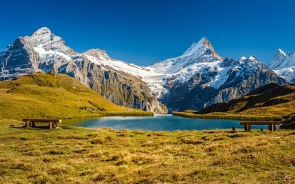 encountering bachalpsee during the famous hiking trail from first to grindelwald (bernese alps, switzerland). you can have great views on mountains like the eiger, monch and jungfrau.