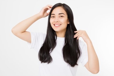 young asian woman with brunette healthy clean shiny hair isolated on white background. girl long hairstyle. copy space