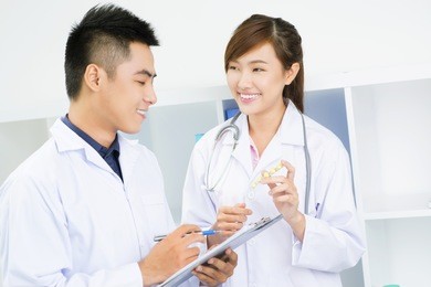two young doctors prescribing pills
