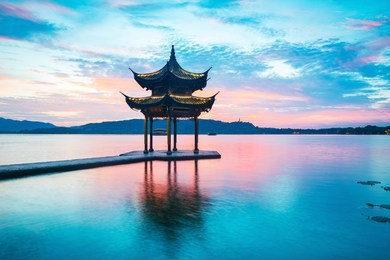 jixian pavilion in hangzhou during sunset.the chinese word in photo means"jixian pavilion".chinese ancient pavilion on the west lake in hangzhou.west lake   of the most famous scenic spots in china.