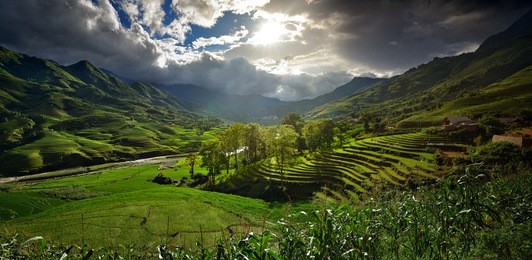 landscape with rice terraces and mountain river on a sunny day, playing with shadows and light. panorama.
