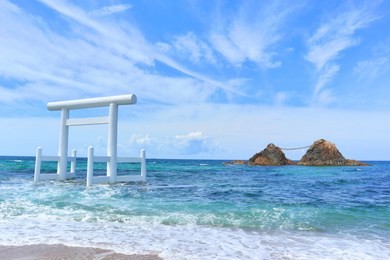 meotoiwa and white torii gate, at itoshima bay, fukuoka prefecture, japan