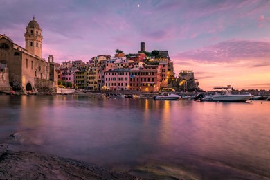 vernazza cinque terre  one of the five towns that make up the cinque terre region.
vernazza sunset liguria, italy, europe. splendid seascape evening of mediterranean sea night lights