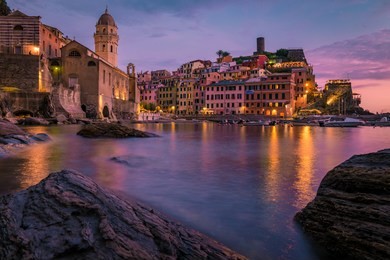 vernazza cinque terre  one of the five towns that make up the cinque terre region.
vernazza sunset liguria, italy, europe. splendid seascape evening of mediterranean sea night lights