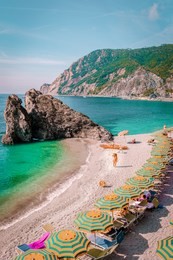 young woman walking at the beach of monterosso cinque terre italy