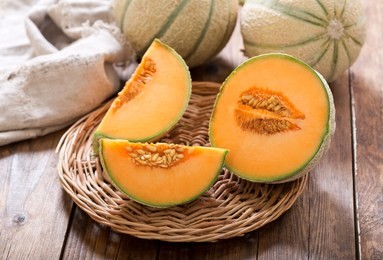 close up of cantaloupe melon on wooden table
