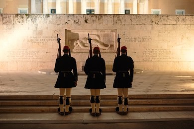evzones guarding the tomb of the unknown soldier in athens 