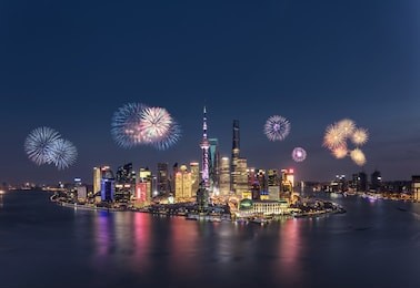 fireworks and cityscape in shanghai at night