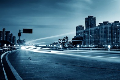 the light trails on the modern building background in china.