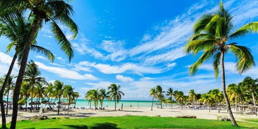 varadero, cuba, paradisus varadero resort, sep, 2, 2018, beautiful, mesmerizing, gorgeous  wide open view of a beach and tranquil ocean with people relaxing in background on sunny nice day