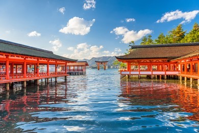 miyajima, hiroshima, japan at itsukushima shrine with the tide rolling in.