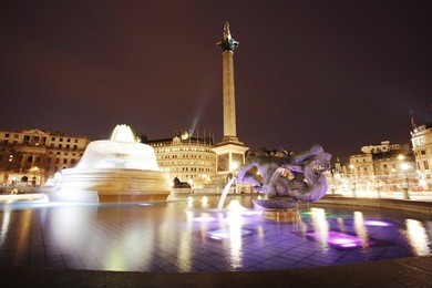 trafalgar square with nelson column at night