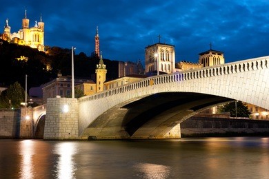 classical view of lyon over the saone river at cloudy night.