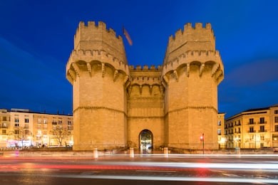 serrano towers old city gate in valencia on night time, spain, europe