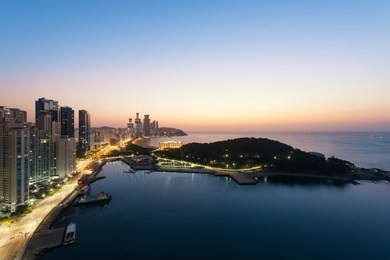 sunrise at haeundae beach in busan. haeundae beach is busan's most popular beach in south korea.