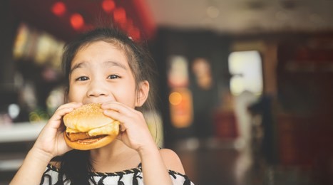 asian children eat chicken cheese hamburger food court