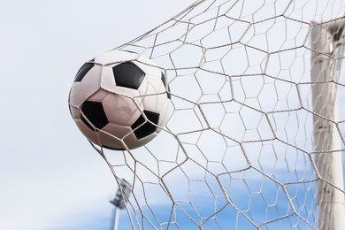 football in the goal net