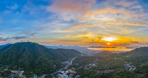 aerial view sunrise in chalong sea phuket big buddha is on the top of nakkerd mountain.phuket big buddha is the famous landmark in phuket island  a lot of tourists visiting this landmark every day 