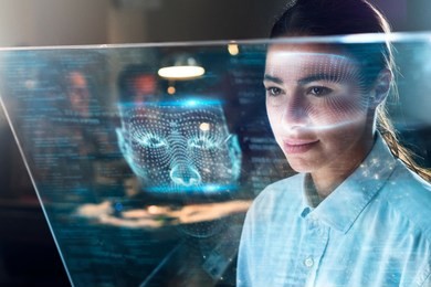 futuristic and technological scanning of the face of a beautiful business woman for facial recognition. it can serve to ensure personal safety at work. 