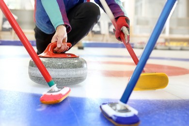curling, team playing on the ice.