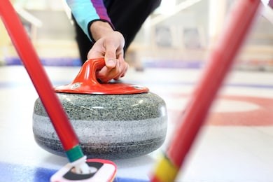 curling. players play curling on the curling track.